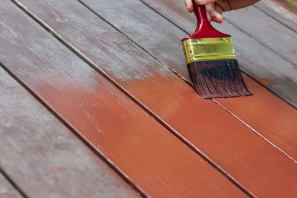 Deck Contractor Painting a Deck - North Shore Deck Builders