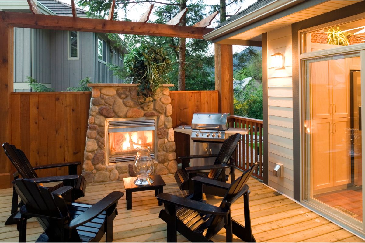 outdoor patio with fireplace chair and bbq grills