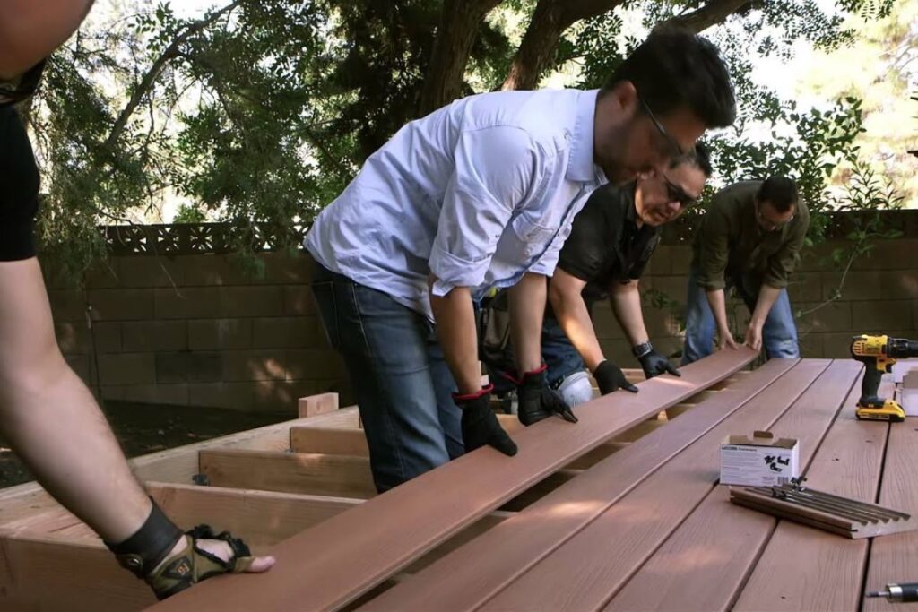 team of contractors replaced old wooden deck with new decks