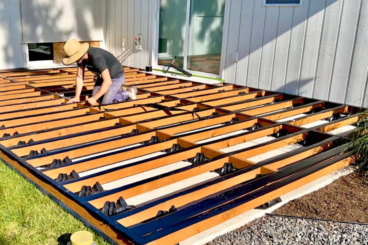 man installing outdoor patio