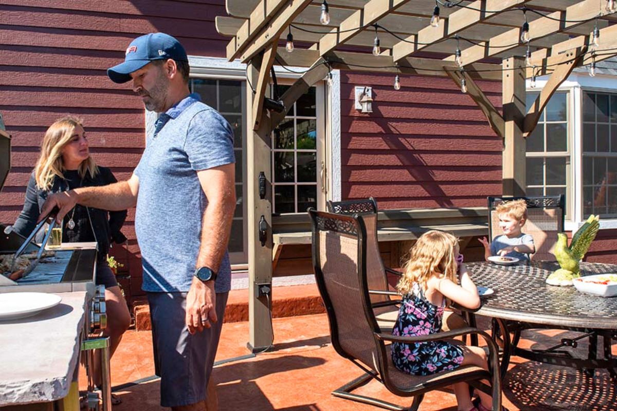 happy family relaxing on outdoor pergola