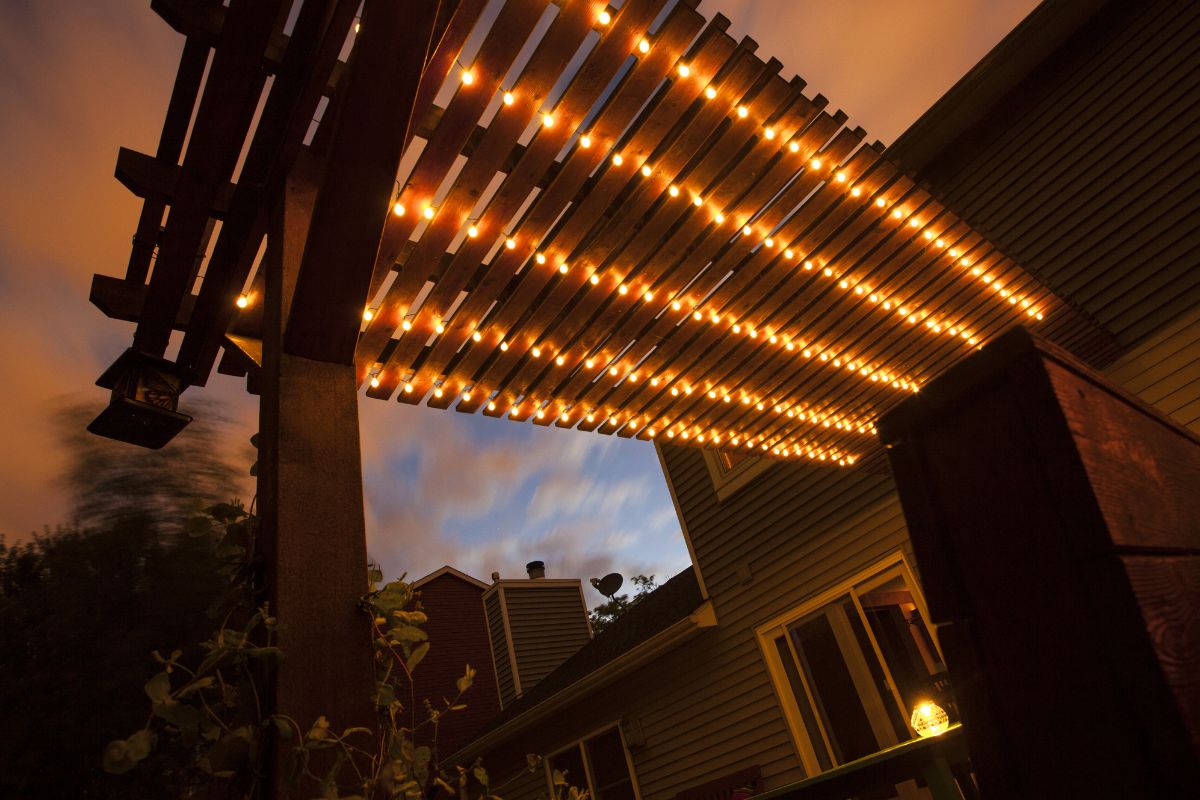 lighted deck pergola at dusk