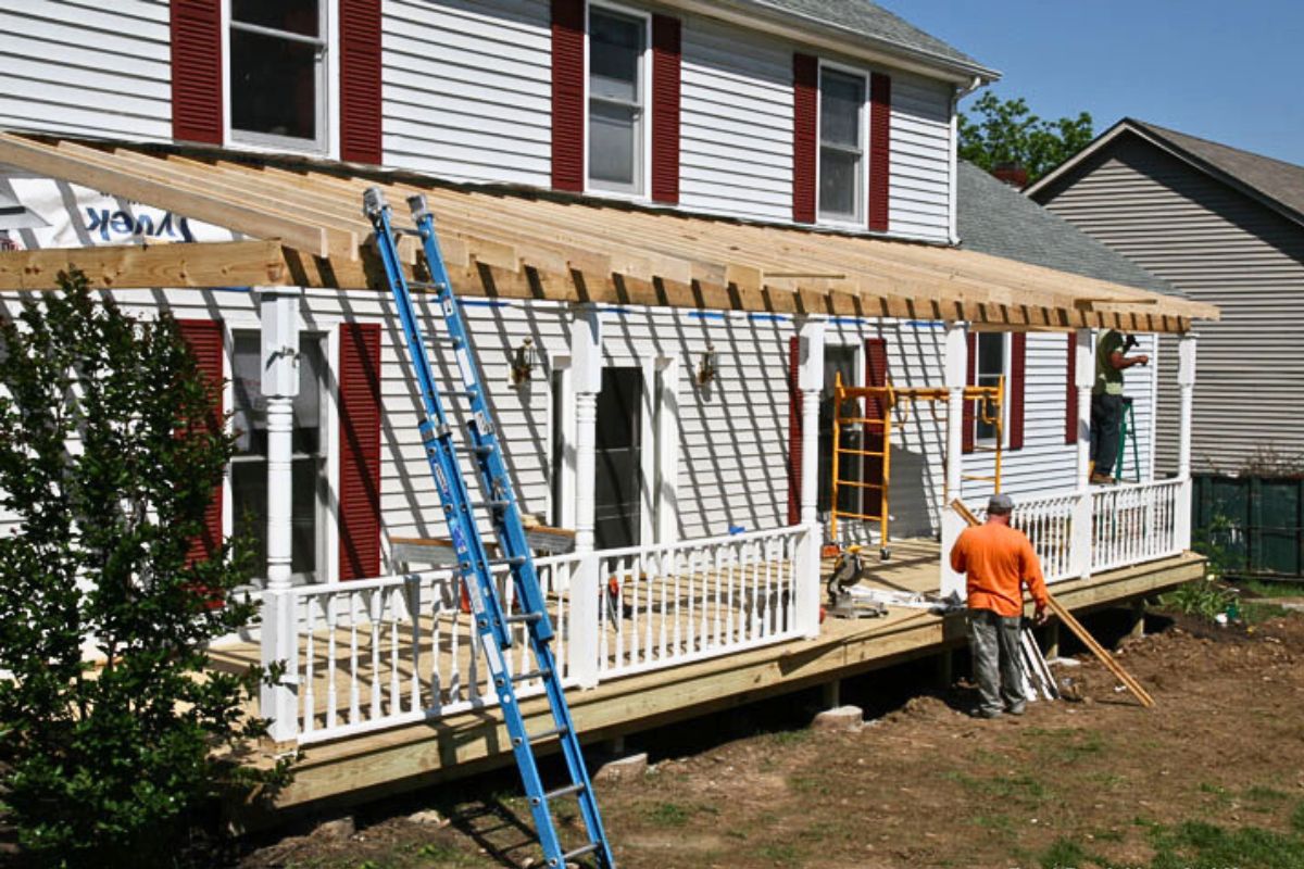 two contractors building a front porch